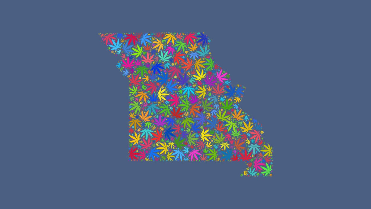 Missouri silhouette made from multicolored cannabis leaves on a muted blue background.