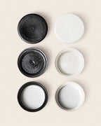 Black and white 38-400 Ocean Screw-Top Lids showing tops and undersides