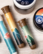 Custom-branded 78mm Hemp Tube alongside other Sana Packaging products on a wooden surface